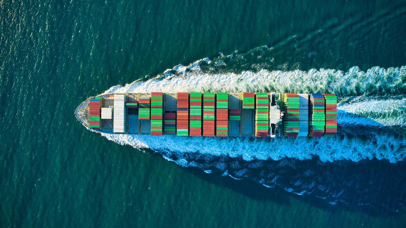 Container ship at sea viewed from above